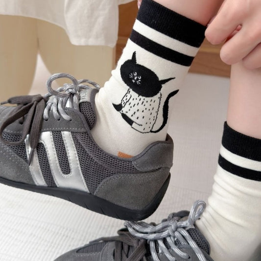 Close-up of Rufia cat knit crew sock showing detailed cat face design