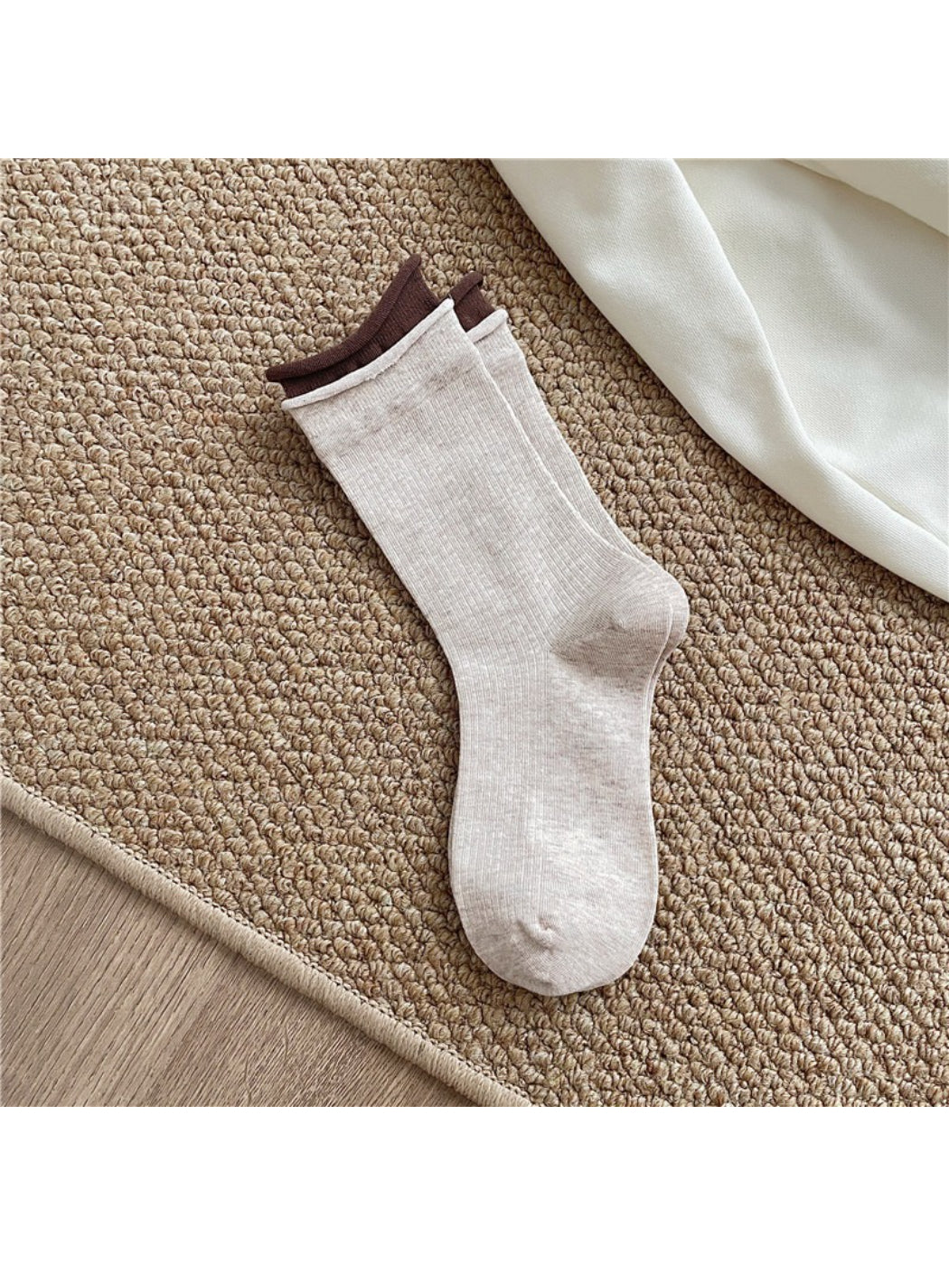 Rufia casual roll cuff crew socks displayed on wooden surface