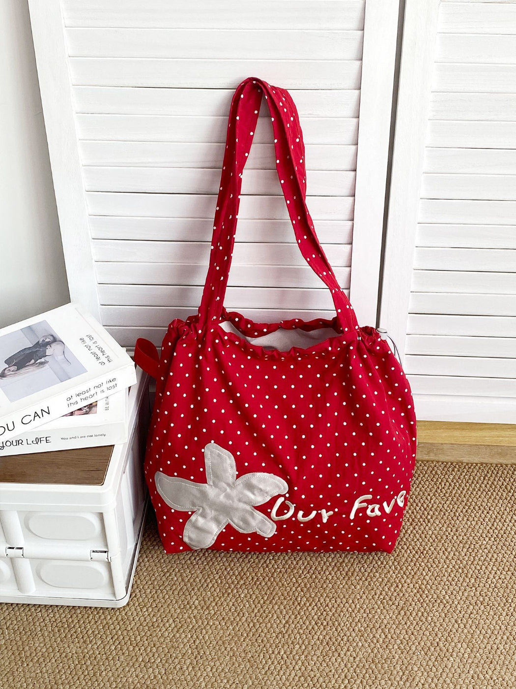 Side view of Cosbai floral patch slouchy shoulder bag showing soft fabric and strap