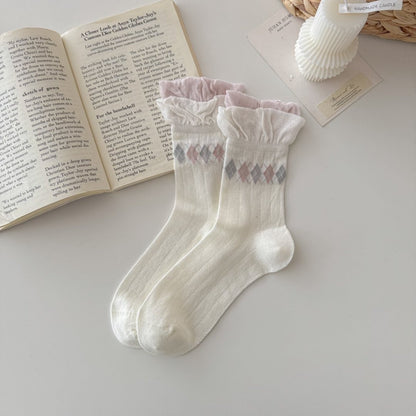 Close-up of soft knit fabric and ruffle trim on Rufia crew socks
