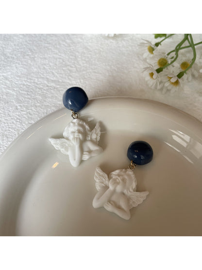 Earwish Angel Charm Drop Earrings displayed on white jewelry stand