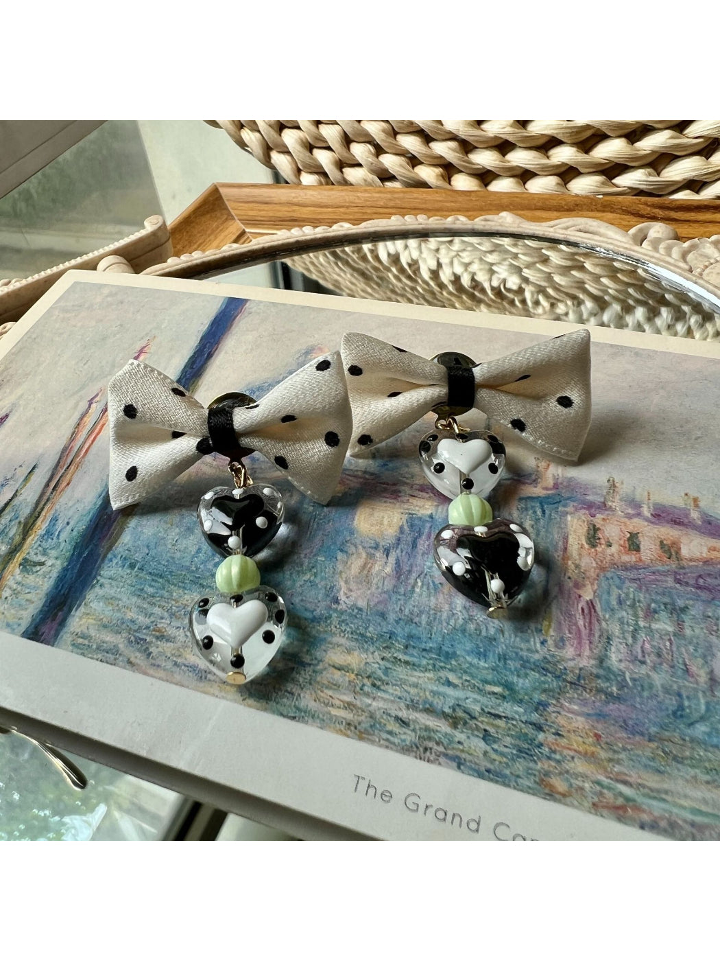 Close-up of Earwish Heart Charm Bow Earrings highlighting heart charm detail
