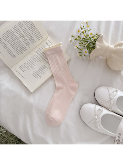 Rufia solid rib texture socks displayed with matching beige outfit
