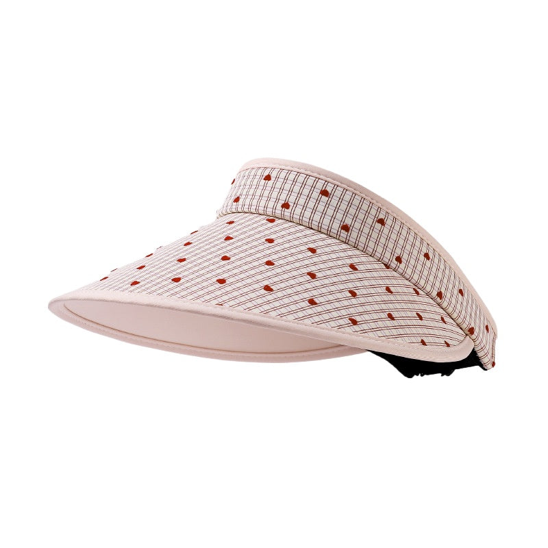 Model wearing Haila open crown summer shade hat outdoors with casual outfit