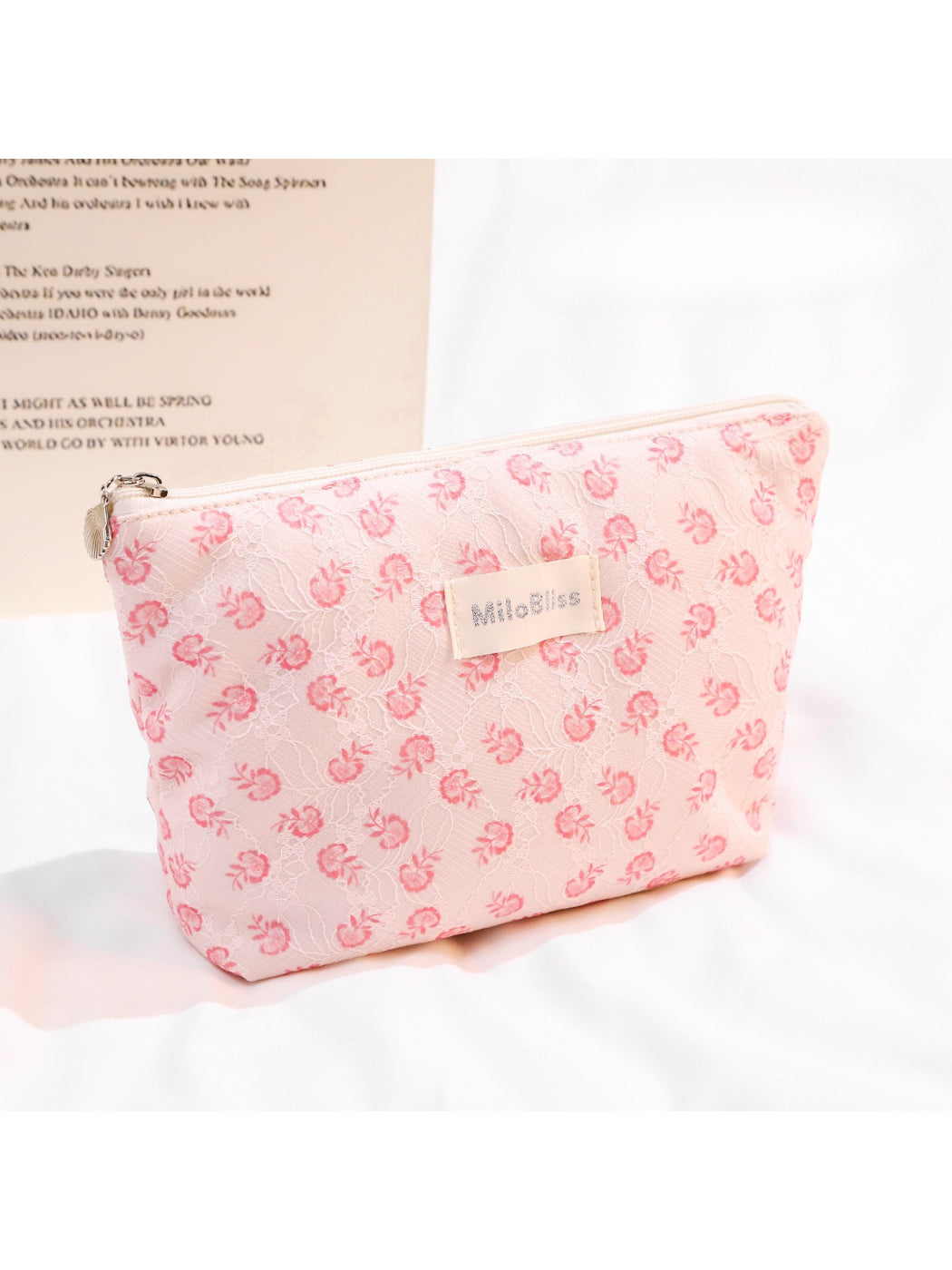 Close-up of Cosbai small floral embroidered makeup pouch showing detailed flower embroidery