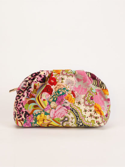 Cosbai clutch bag with colorful floral sequins and gold hardware displayed upright