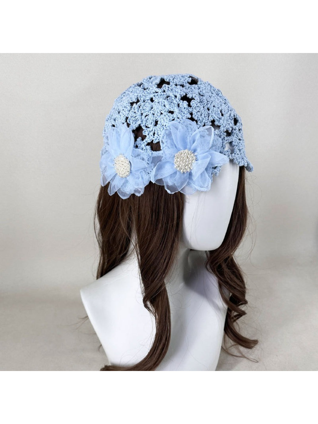 Side view of Haila openwork hat showcasing intricate flower detail and delicate weave