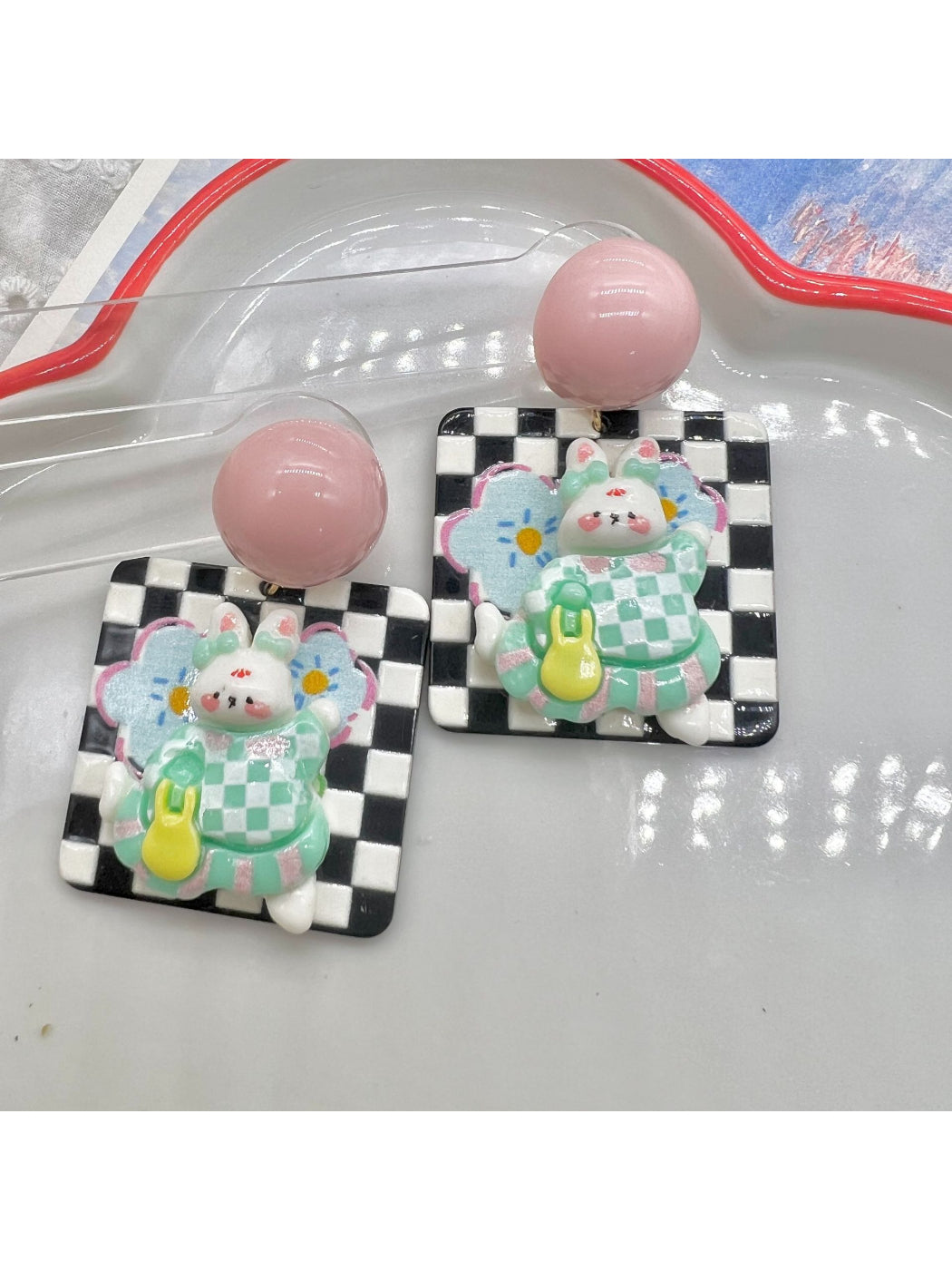 Side view of Earwish Bunny Check Drop Earrings highlighting drop style