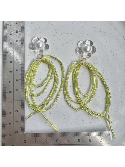 Side view of Earwish green bead dangle earrings showing bead details and silver hooks