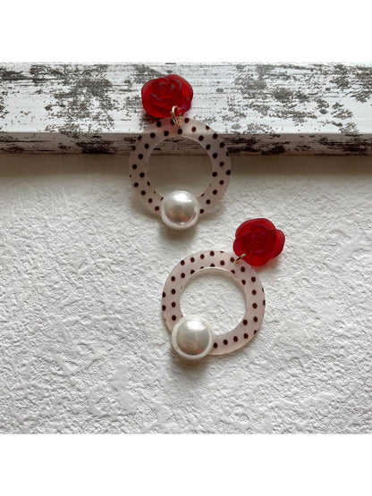 Side view of Earwish Polka Dot Ring Drop Earrings with silver ring and polka dot detail