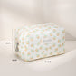 Cosbai small floral makeup organizer placed on a white surface with natural lighting
