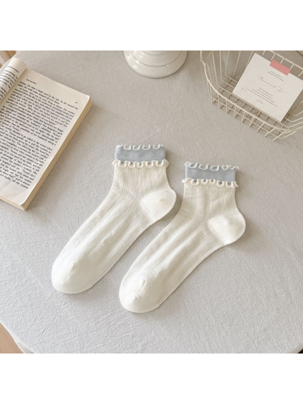 Side view of Rufia Sweet Frill Edge Ribbed Socks in light gray highlighting ribbing and frill