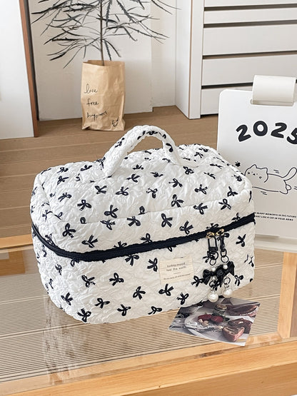 Side view of Cosbai travel makeup bag highlighting compact size and bow print design