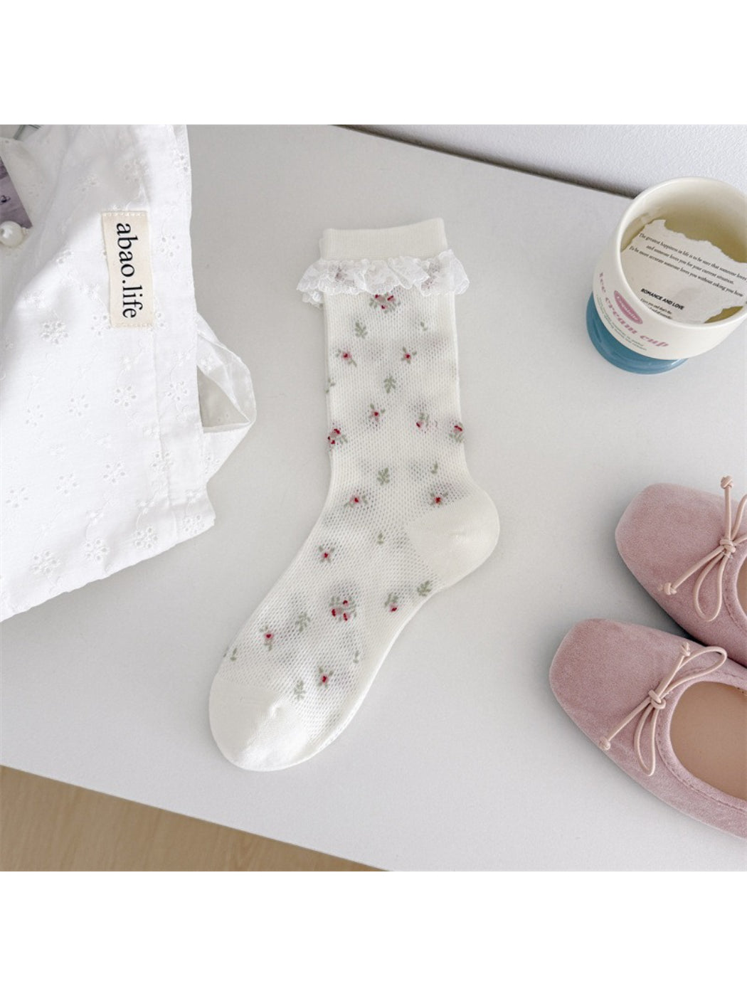 Top view of Rufia Romantic Lace Cuff Crew Socks showing lace cuff and toe area