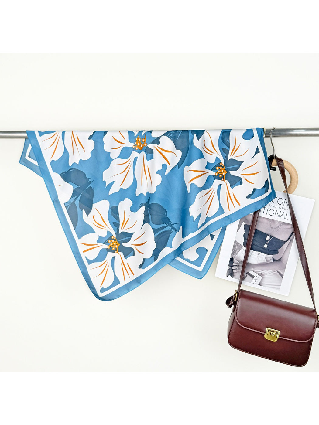 Scarvii Lily Print Square Scarf folded neatly with visible pink lilies and green leaves on white background