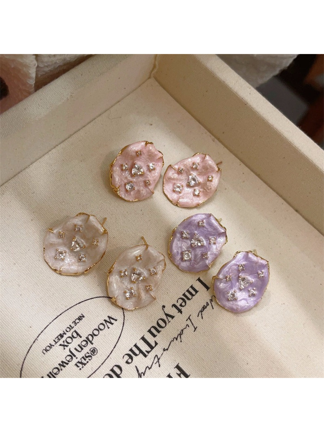 Earwish soft color floral stud earrings displayed on a white background