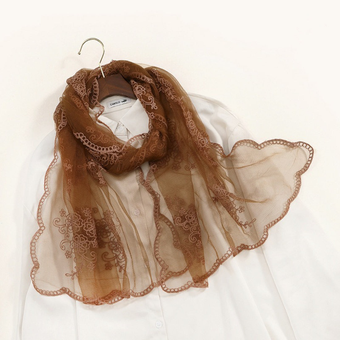 Scarvii scarf edges showing fine stitching and embroidered details