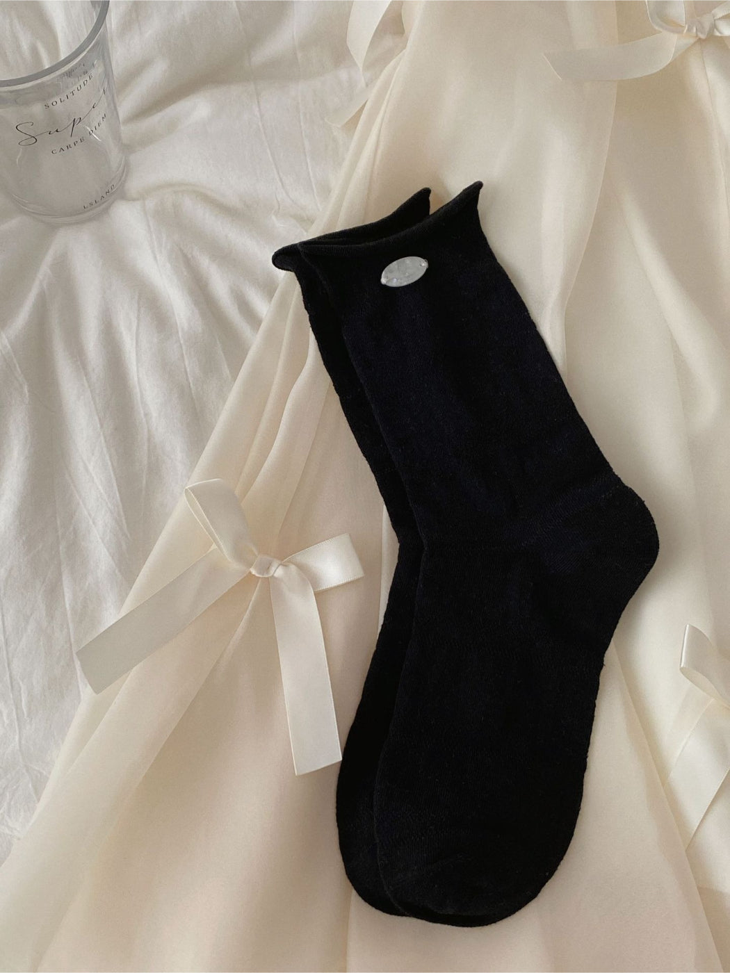 Rufia mesh dot mid-calf socks displayed on a mannequin leg showing fit and pattern