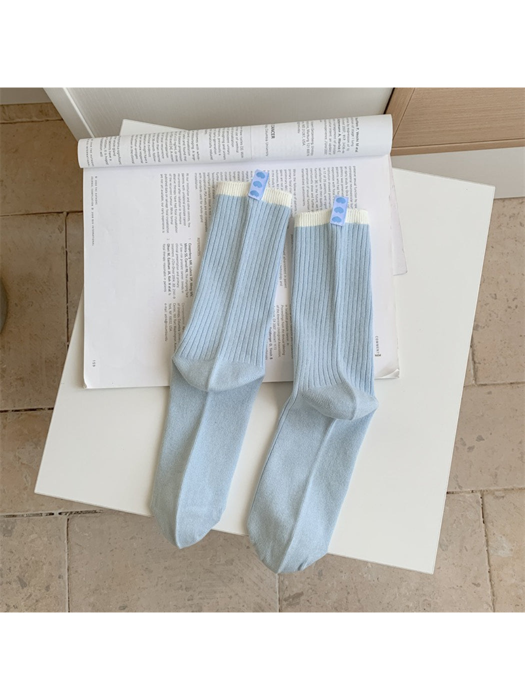 Side view of Rufia crew socks highlighting the contrast stripe and soft material