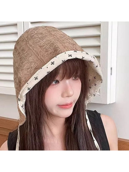 Haila ditsy floral reversible bonnet showing pink floral pattern on light background