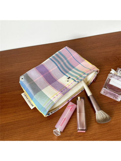 Cosbai Classic Plaid Travel Cosmetic Pouch shown with travel essentials inside