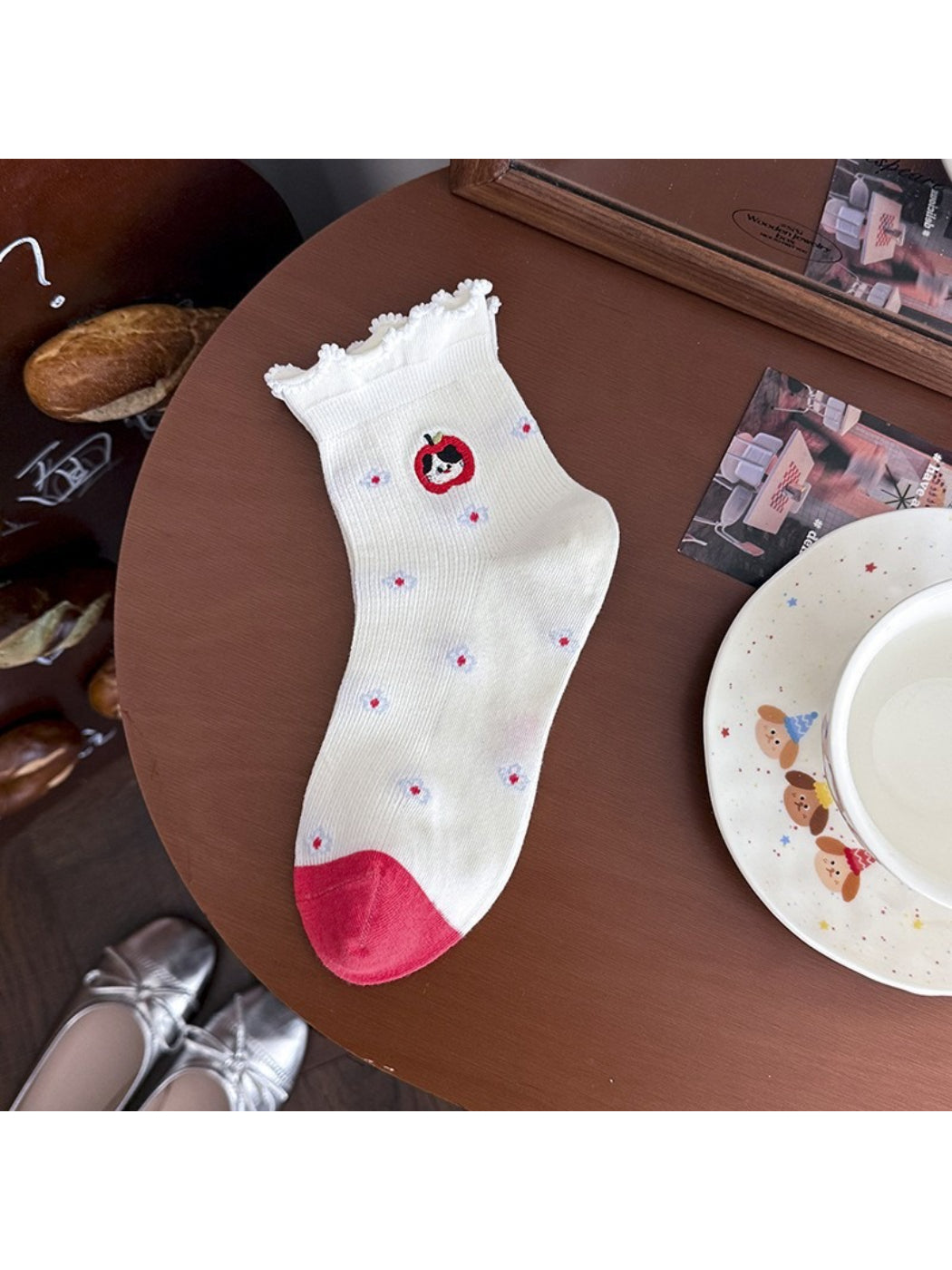 Rufia lace ruffle ankle socks worn with shoes, showing ankle ruffle peeking out