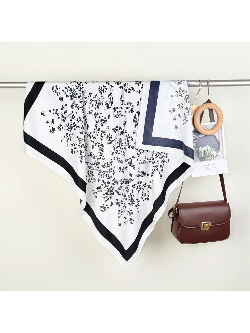 Soft Blossom Square Scarf folded neatly with visible pastel floral motifs