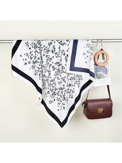 Soft Blossom Square Scarf folded neatly with visible pastel floral motifs