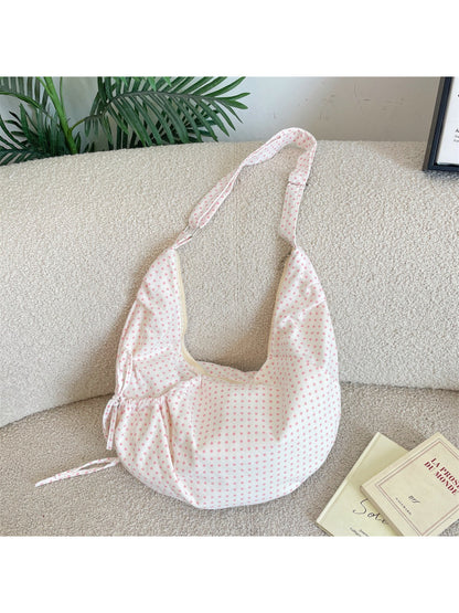 Side view of Cosbai Polka Dot Crescent Shoulder Bag showing curved shape and strap