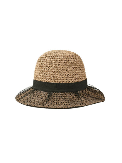 Close-up of black lace pattern on straw look hat with scalloped edge