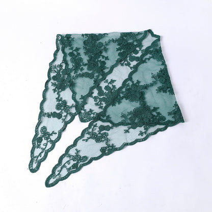 Close-up of floral lace pattern on Haila veil head scarf with soft focus background