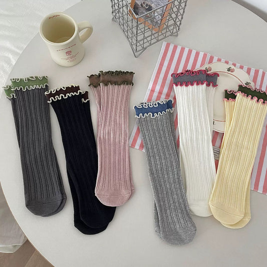 Rufia contrast wave trim long socks in black and white, flat lay