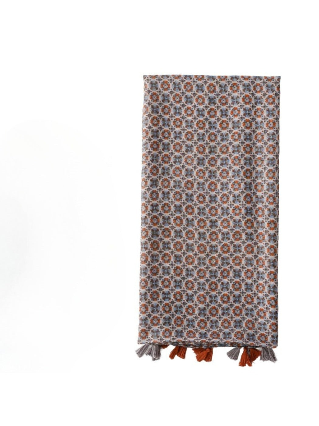 Close-up of delicate floral pattern and fringed edges on vintage scarf