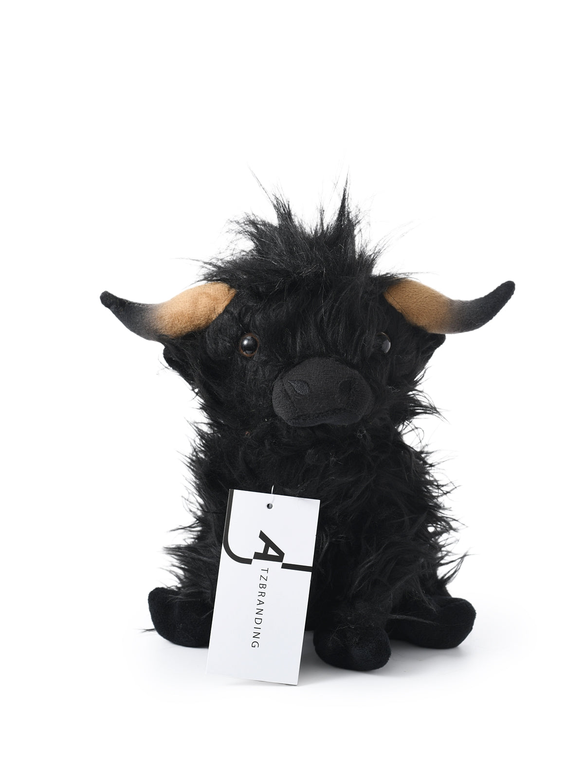 Cow plush toy with embroidered face details