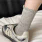 Side view of Rufia Pale Bow Everyday Socks highlighting mid-calf length