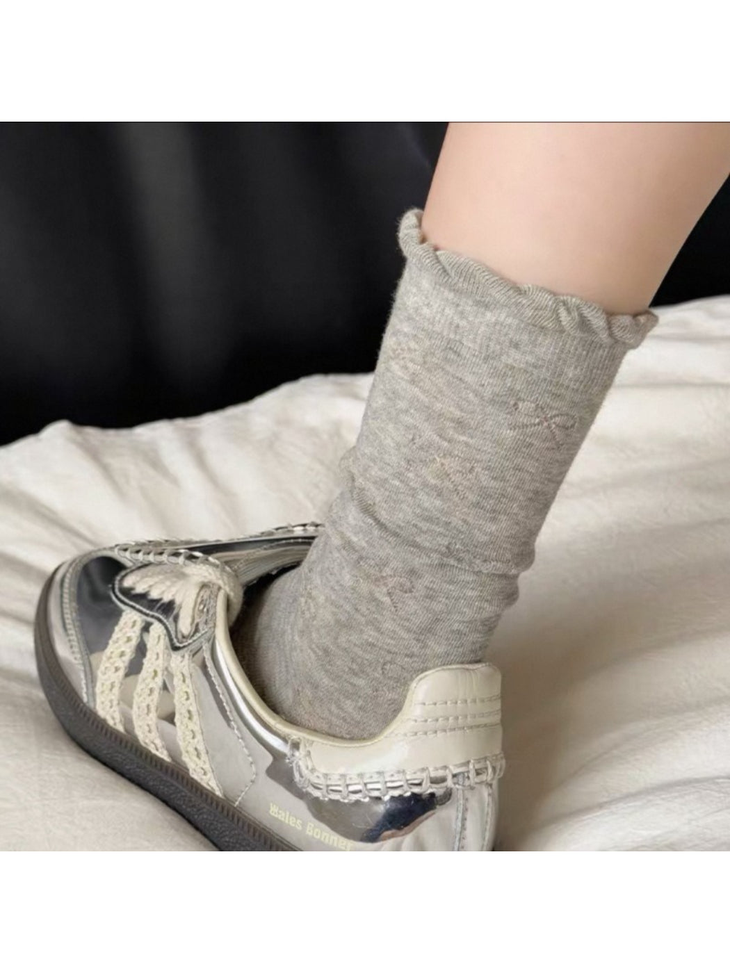 Side view of Rufia Pale Bow Everyday Socks highlighting mid-calf length