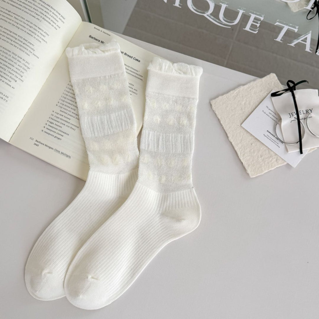 Close-up of cuff area on Rufia floral trim ribbed crew socks showing scalloped floral edge