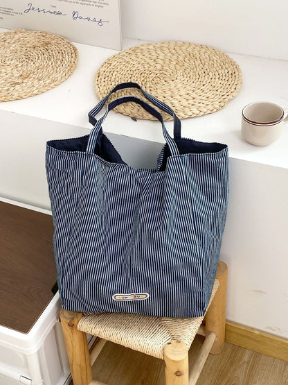 Cosbai tote bag reversed to show alternate striped design