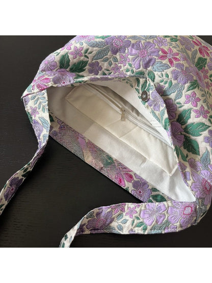 Close-up of purple floral fabric and stitching on Cosbai shoulder bag