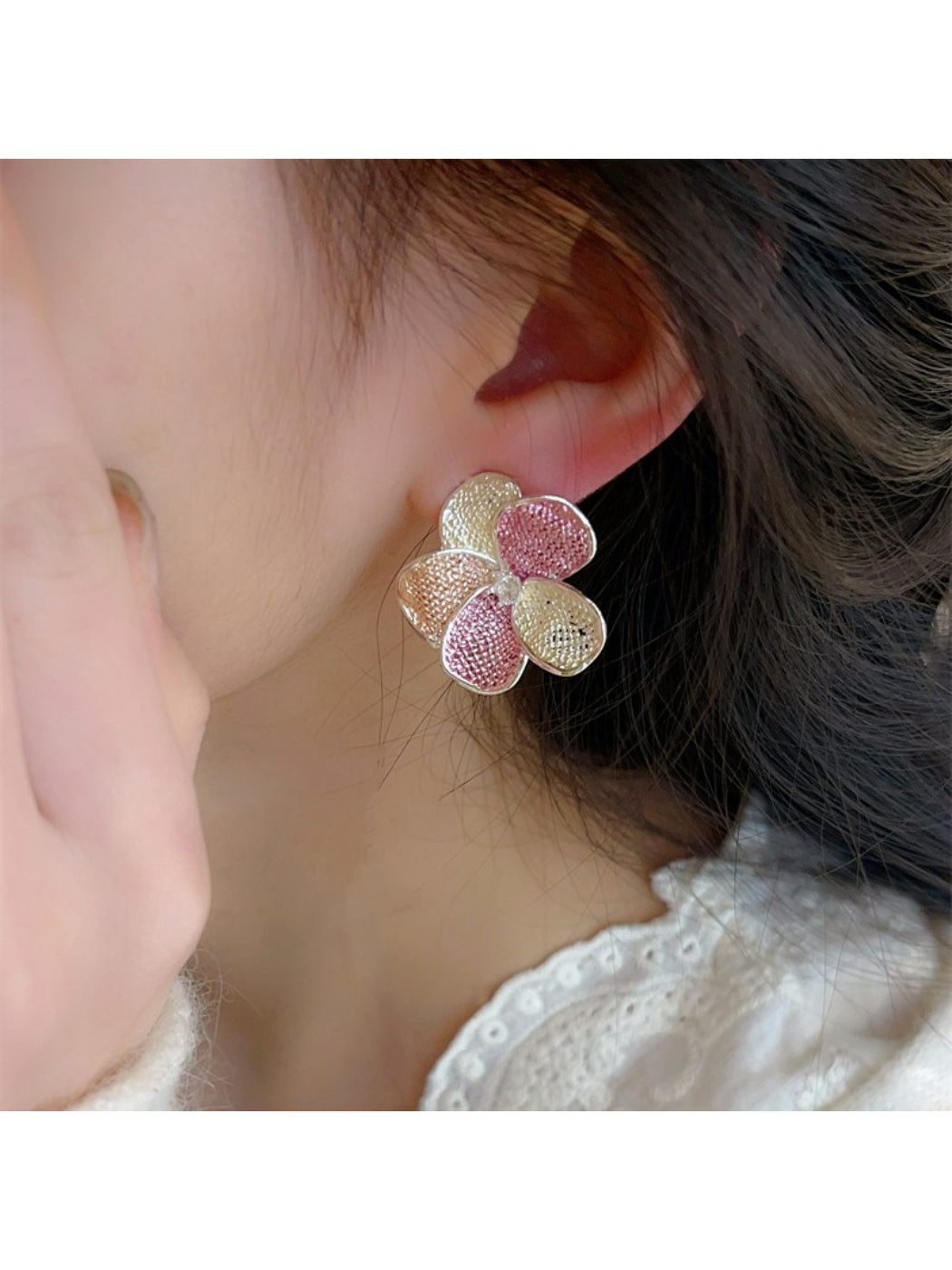 Side view of Earwish multicolor floral cluster earrings highlighting the clasp