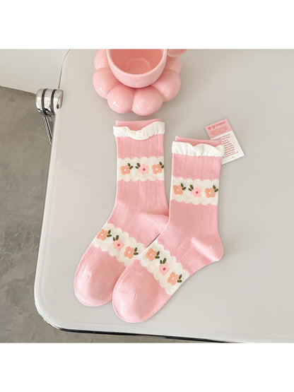 Side view of Rufia pink floral ribbed crew sock highlighting ribbing and floral print