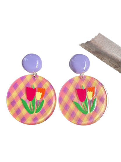 Model wearing Earwish Tulip Gingham Drop Earrings with pink gingham pattern