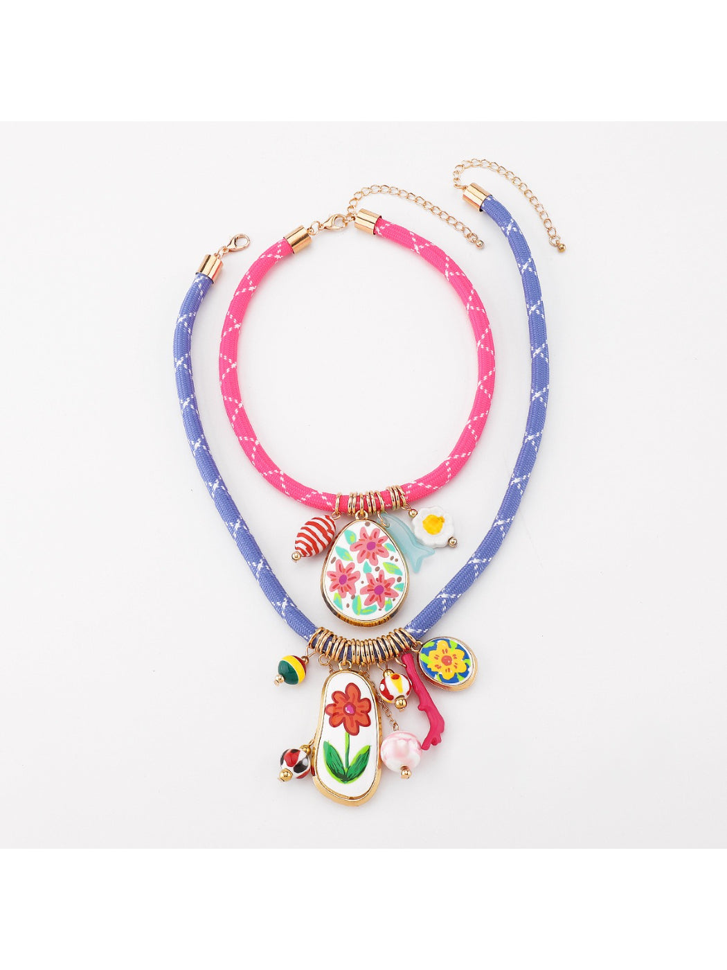 Close-up of silver clasp and colourful beads on multi charm rope necklace