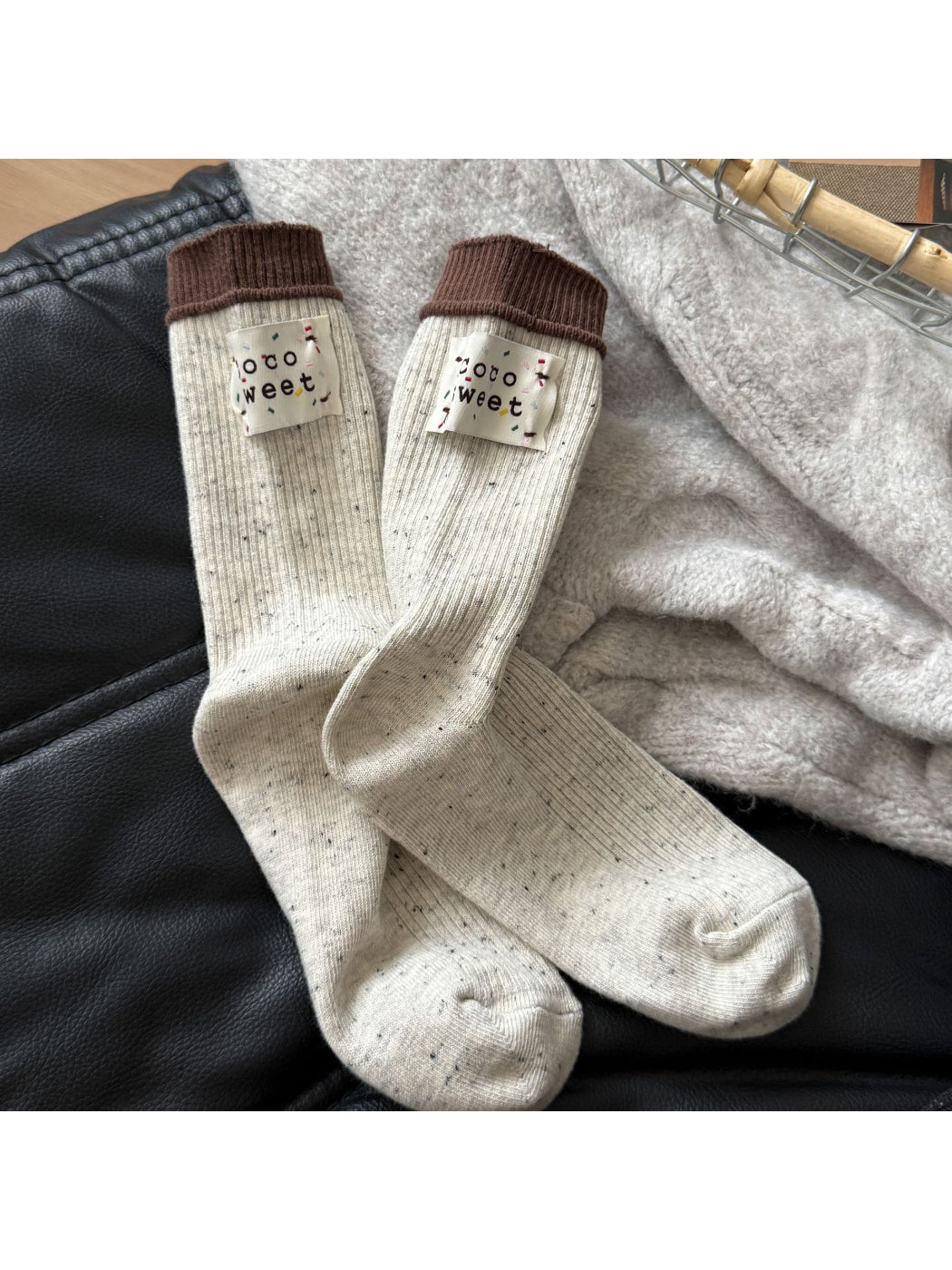 Model wearing Rufia speckle knit crew socks with rolled-up jeans