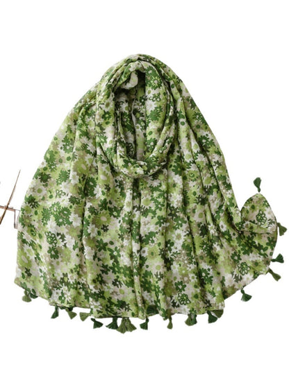 Bright ditsy floral wrap scarf styled as headscarf on model
