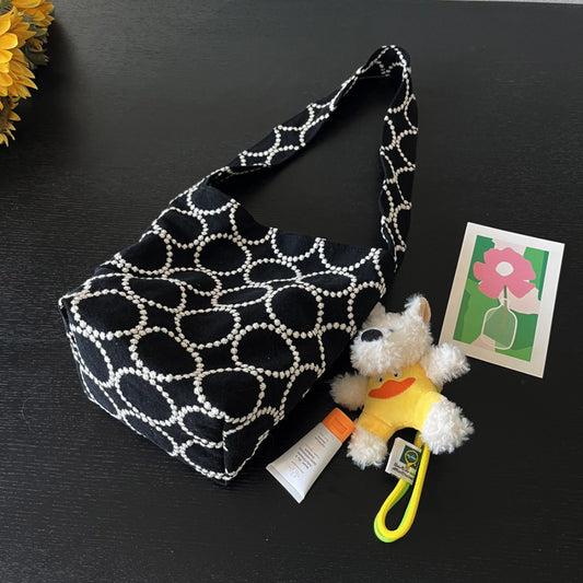 Black embroidered dot stitch soft hobo bag with short strap