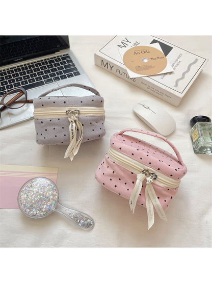 Cosbai mini cosmetic case with black background and white star print, closure