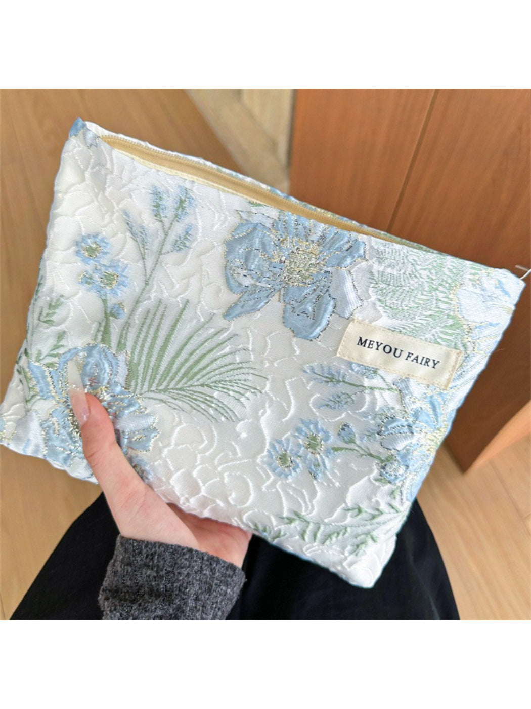 Cosbai blue floral cosmetic bag with a zipper on a white background