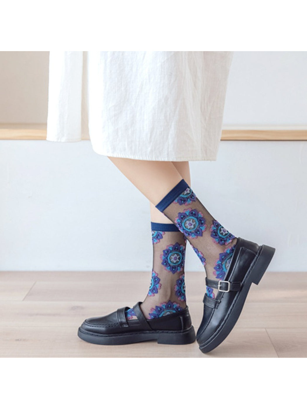 Close-up of Rufia sheer blossom pattern crew socks fabric and floral details