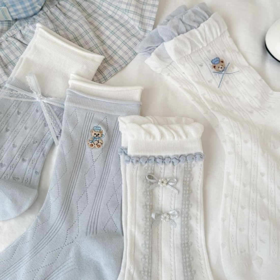Pair of Rufia Bear Embroidered Ribbon Crew Socks laid flat showing bear embroidery on the side